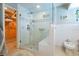 Bathroom featuring a large shower with glass doors and a bidet at 3545 Seaway Dr, New Port Richey, FL 34652