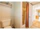 Bathroom featuring a toilet, shower with curtain, and a towel rack at 3545 Seaway Dr, New Port Richey, FL 34652