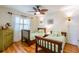 Bedroom with two twin beds, wood floors, and natural light from the window at 3545 Seaway Dr, New Port Richey, FL 34652