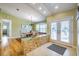 Light and bright dining area with built in seating, a view, and wood floors at 3545 Seaway Dr, New Port Richey, FL 34652