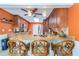 Eat-in kitchen featuring granite countertops, pendant lighting, and a breakfast bar with seating for three at 3545 Seaway Dr, New Port Richey, FL 34652
