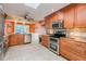 Spacious kitchen with stainless steel appliances, granite countertops, and ample cabinet space at 3545 Seaway Dr, New Port Richey, FL 34652