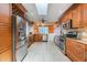 Spacious kitchen with stainless steel appliances, wine rack, and bright lighting at 3545 Seaway Dr, New Port Richey, FL 34652