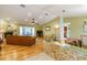 Open-concept living room featuring hardwood floors and a fireplace at 3545 Seaway Dr, New Port Richey, FL 34652
