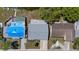 Aerial view of the house showcasing the layout of the property and nearby outdoor living spaces at 3553 Delta Pl, Holiday, FL 34691