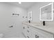 Bright bathroom with dual sinks, quartz countertops and LED mirrors at 3553 Delta Pl, Holiday, FL 34691