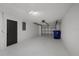 Spacious garage with epoxy floor has a garage door opener at 3553 Delta Pl, Holiday, FL 34691