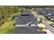 A beautiful view of the neighborhood with pools and well-manicured lawns under a partly cloudy sky at 3966 Tour Trce, Land O Lakes, FL 34638