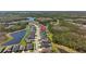 Aerial view of a residential neighborhood with lakes and tree lined streets at 3966 Tour Trce, Land O Lakes, FL 34638
