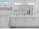 Bright bathroom with a dual vanity, large mirror, and walk-in shower with decorative tile accent at 3966 Tour Trce, Land O Lakes, FL 34638