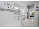Modern bathroom showcasing a spacious walk-in shower with glass partition and tile extending into the bedroom at 3966 Tour Trce, Land O Lakes, FL 34638