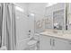 Bright bathroom featuring a shower-tub combo, toilet and vanity with modern finishes at 3966 Tour Trce, Land O Lakes, FL 34638