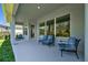 Inviting covered patio with comfortable seating, offering a relaxing outdoor space at 3966 Tour Trce, Land O Lakes, FL 34638