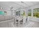Bright dining room with large windows offering views of the lush outdoors at 3966 Tour Trce, Land O Lakes, FL 34638
