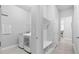 Well-lit laundry area with modern appliances, built-in bench and access to a hallway at 3966 Tour Trce, Land O Lakes, FL 34638