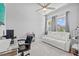 Office/flex space offers a comfortable white couch, a modern desk, and plenty of natural light from the window at 3966 Tour Trce, Land O Lakes, FL 34638
