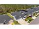Back aerial view of a well-maintained home showing the roof, yard, and neighborhood at 3966 Tour Trce, Land O Lakes, FL 34638