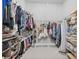 Spacious walk-in closet with organized shelving and hanging rods for clothes and accessories at 3966 Tour Trce, Land O Lakes, FL 34638
