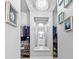 Walk-in closet featuring custom shelving, organized storage, and elegant decor at 3966 Tour Trce, Land O Lakes, FL 34638