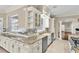 Gourmet kitchen with granite counters, farmhouse sink, and stainless steel appliances at 4404 Lake In The Woods Dr, Spring Hill, FL 34607