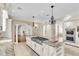 Chef's kitchen with a granite island, stainless appliances, and custom cabinets at 4404 Lake In The Woods Dr, Spring Hill, FL 34607