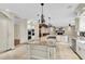 Gourmet kitchen with stainless steel appliances, island with cooktop, and open layout at 4404 Lake In The Woods Dr, Spring Hill, FL 34607