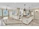 Open kitchen with double islands, granite countertops, and custom cabinetry at 4404 Lake In The Woods Dr, Spring Hill, FL 34607