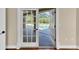 French doors in the home provide convenient access to the screened-in lanai and outdoor pool area at 4404 Lake In The Woods Dr, Spring Hill, FL 34607