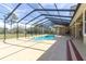 Beautiful screened-in pool and spa, offering a private oasis with views of the lush surroundings at 4404 Lake In The Woods Dr, Spring Hill, FL 34607
