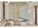 Luxury bathroom boasts a spacious, frameless glass shower with a built-in bench and multiple showerheads at 4404 Lake In The Woods Dr, Spring Hill, FL 34607