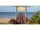 View of the Wesley S. Henry Community Pier extending into the tranquil waters of Crystal Beach at 512 Tennessee Ave, Crystal Beach, FL 34681