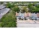 Aerial view of townhomes and guest parking spots nestled amongst trees at 5704 Bratton Dr # 2, Tampa, FL 33617