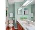 A quaint bathroom with a well lit vanity and a commode at 5704 Bratton Dr # 2, Tampa, FL 33617
