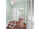 An interior view of the home's hallway, featuring wood floors and fresh paint at 5704 Bratton Dr # 2, Tampa, FL 33617