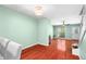 Light-filled living room with hardwood floors, a fireplace, and a bright front door at 5704 Bratton Dr # 2, Tampa, FL 33617