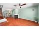 Bright living room featuring wood floors and a fireplace, open to dining and kitchen at 5704 Bratton Dr # 2, Tampa, FL 33617