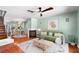 Inviting living room with fireplace, ceiling fan, and open concept to kitchen, perfect for entertaining at 5704 Bratton Dr # 2, Tampa, FL 33617