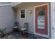 Inviting patio with tiled floor, a red door, and seating at 5704 Bratton Dr # 2, Tampa, FL 33617