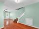 Inviting room with hardwood floors, staircase access, and a view towards the backyard at 5704 Bratton Dr # 2, Tampa, FL 33617
