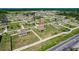 Aerial perspective of a residential area showing a home with a spacious yard and surrounding neighborhood layout at 733 Garden Oaks Sq, Seffner, FL 33584
