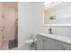 Stylish bathroom with an illuminated mirror, modern vanity, and a separate shower space at 733 Garden Oaks Sq, Seffner, FL 33584