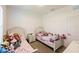 bedroom featuring two beds, a nightstand, and decor with a variety of stuffed animals at 733 Garden Oaks Sq, Seffner, FL 33584