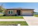 Charming single Gathering home with a well manicured lawn and two car garage at 733 Garden Oaks Sq, Seffner, FL 33584