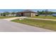 Charming home with a well-manicured lawn, concrete driveway, and attached two-car garage at 733 Garden Oaks Sq, Seffner, FL 33584
