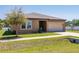 Charming single Gathering home with a well manicured lawn and two car garage at 733 Garden Oaks Sq, Seffner, FL 33584