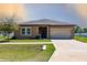 Charming single Gathering home with a well manicured lawn and two car garage at 733 Garden Oaks Sq, Seffner, FL 33584