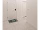 Bright hallway with a decorative welcome rug on top of white tile flooring at 733 Garden Oaks Sq, Seffner, FL 33584