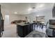 Open-concept kitchen featuring a kitchen island, stainless steel appliances, and backyard views at 733 Garden Oaks Sq, Seffner, FL 33584