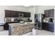 Modern kitchen with granite countertops, tiled backsplash, and stainless steel appliances at 733 Garden Oaks Sq, Seffner, FL 33584