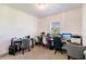 This office area features a large window for natural light and ample room for multiple desks at 733 Garden Oaks Sq, Seffner, FL 33584